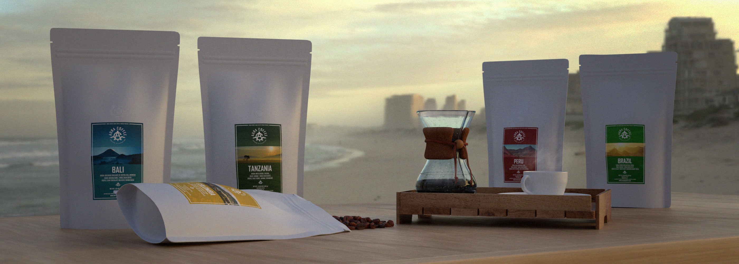 Aura Coffee Single Origin Coffee Collection on a table on the beach. Bali, Tanzania, Colombia, Peru, Brazil Coffees.