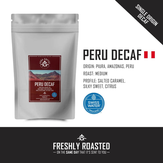 White pouch of Aura Coffee Decaf Peru single-origin coffee with origin and roast details.