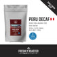 White pouch of Aura Coffee Decaf Peru single-origin coffee with origin and roast details.
