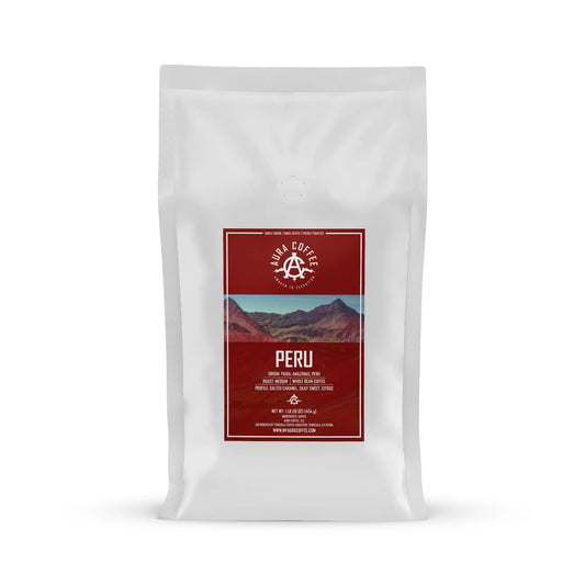 White pouch of Aura Coffee Peru single-origin coffee.